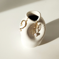 Everleigh Gold Pearl Arch Earrings
					