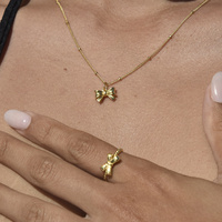 Tilda Bow Earrings & Pendant Necklace & Ring Gift Set (Gold)
					