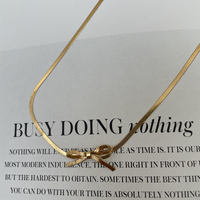 Adria Bow Tie Snake Chain Necklace (Gold)
					