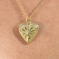 Corena Petal Embossed Heart Pendant Necklace (Gold)
					