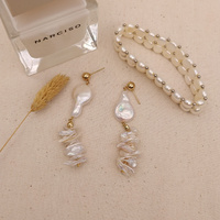 Cleo Mismatching Pearl Stack Earrings (my ears are pierced)