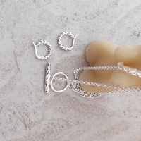 Bryn Beaded Silver Huggie Earrings
					