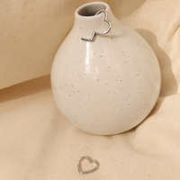 Ayn Open Heart Earrings
					