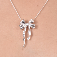 Osmonde Artisan Solid Bow Pendant Necklace
					