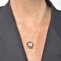 Manon Artsy Solid Knot Pendant Necklace (Silver)
					