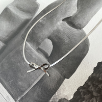 Adria Bow Tie Snake Chain Necklace (Silver)
					