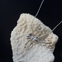 Osmonde Artisan Solid Bow Pendant Necklace
					