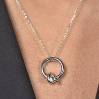 Manon Artsy Solid Knot Pendant Necklace (Silver)
					
