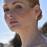 Alexandrine Sculptured Twin Heart Drop Earrings