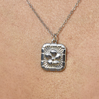 Coretta Embossed Flower Pendant Necklace (Silver)
					